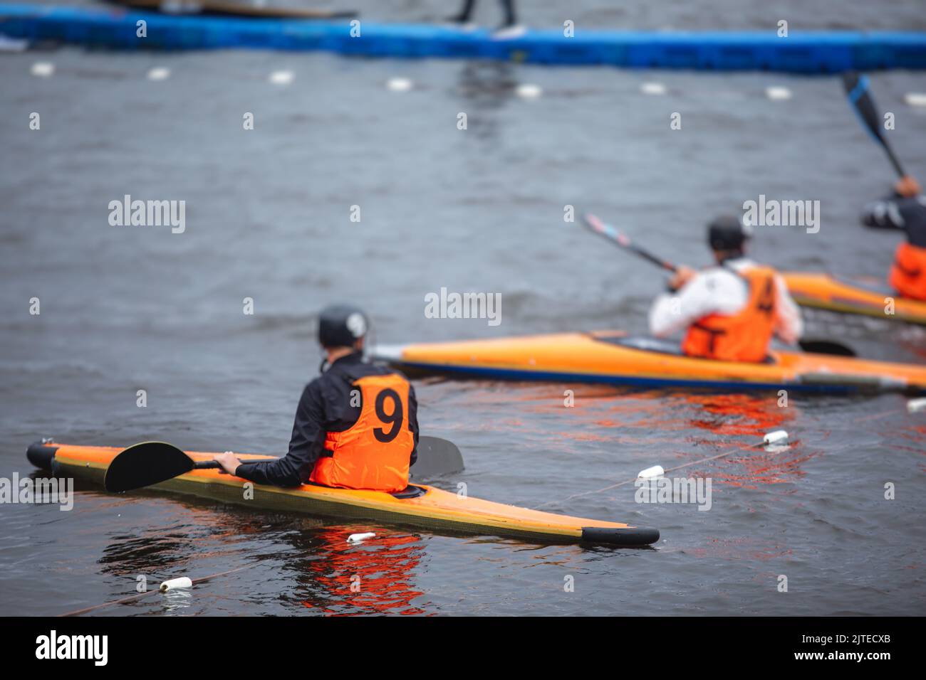 Canoe polo match, two teams play kayak polo game outdoor competition in