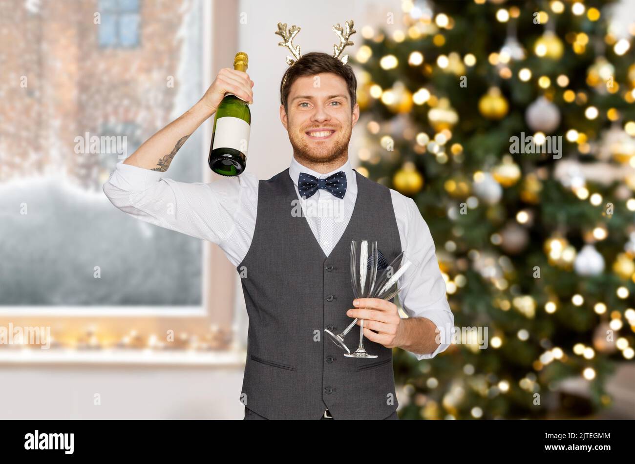 man with bottle of champagne at