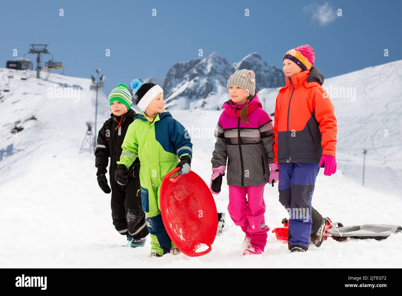 happy little children with sleds in winter Stock Photo - Alamy