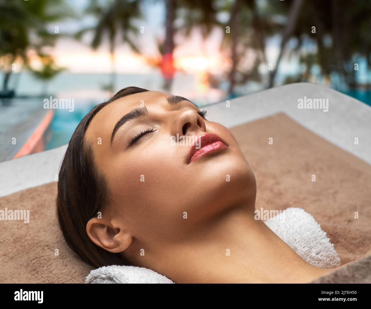 young woman lying at spa over exotic beach Stock Photo