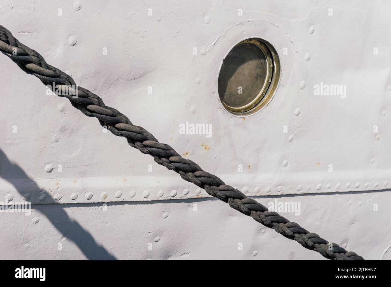 Ship front with porthole and rope Stock Photo