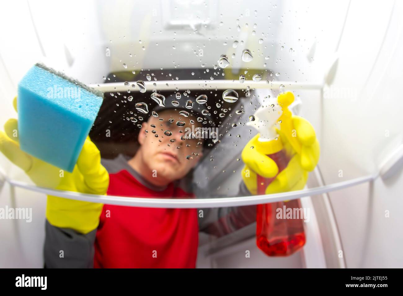 cleaning and washing the inside of the refrigerator with a detergent