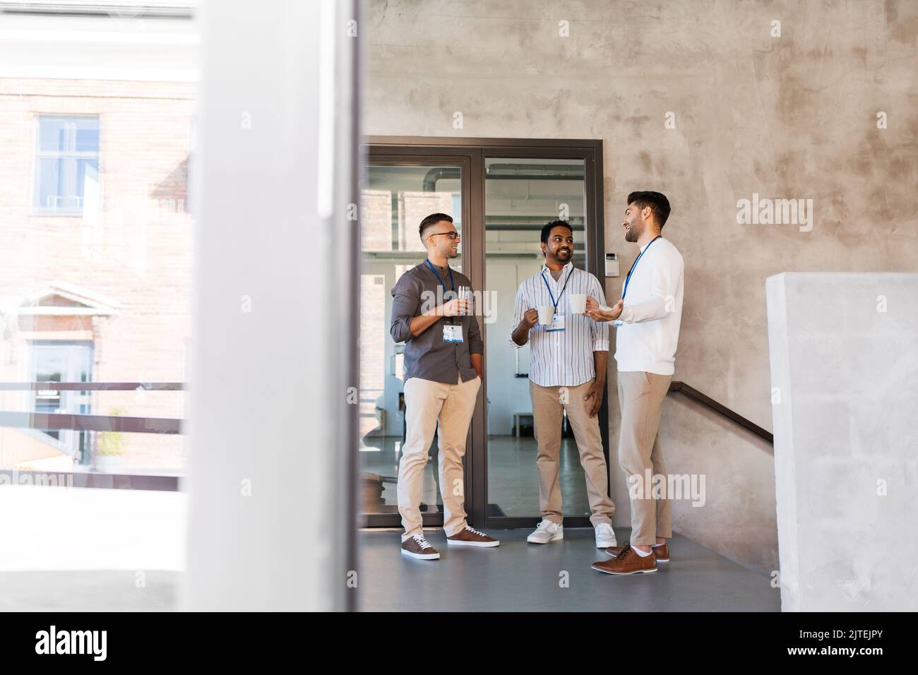 businessmen drinking coffee and water at office Stock Photo