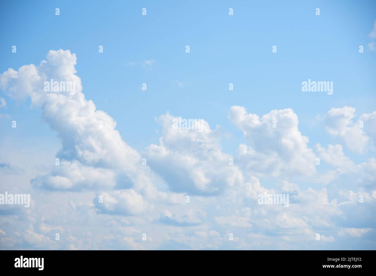 Blue sky background with white fluffy cumulus clouds. Panorama of white ...