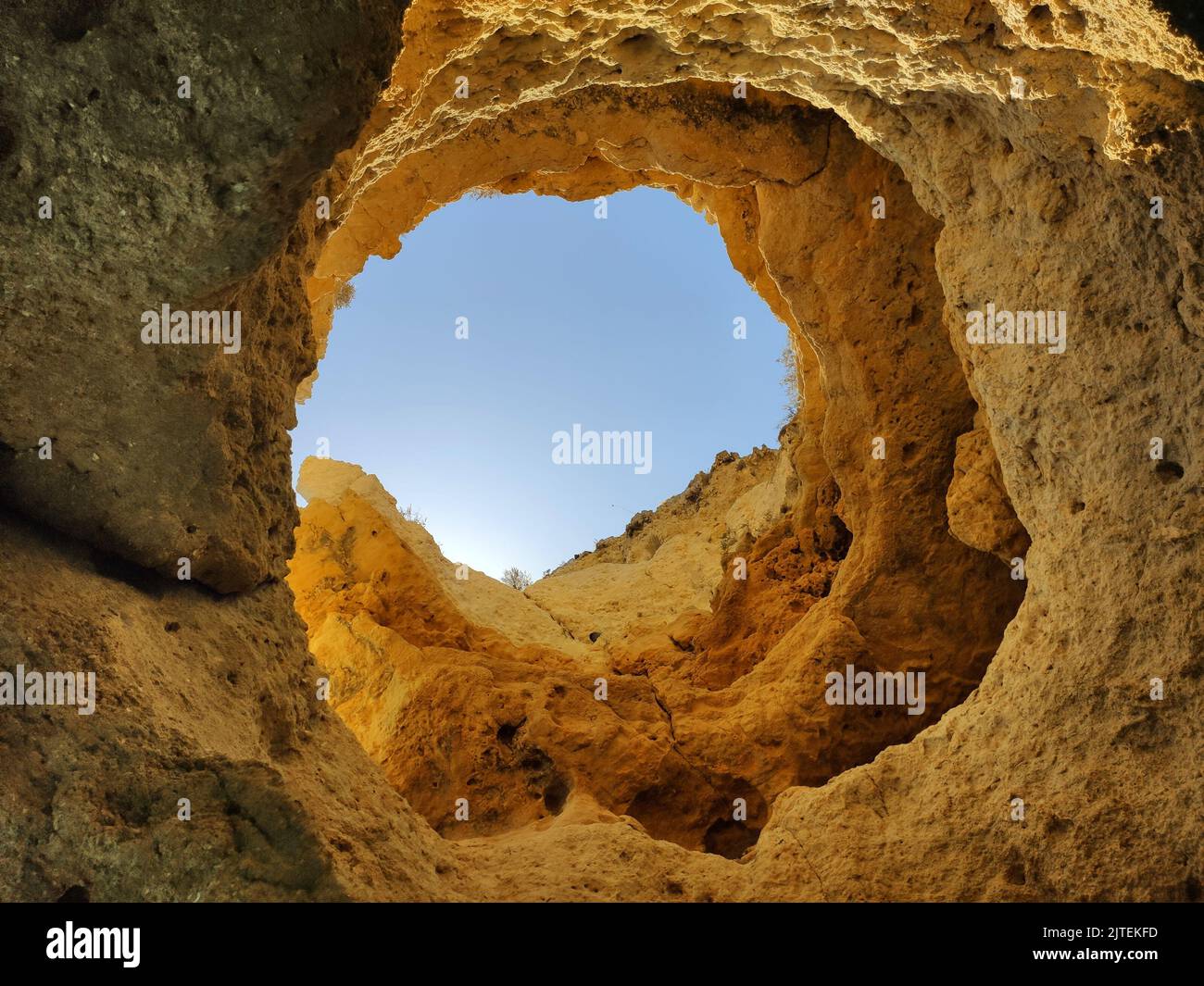 Rock window in sea cave in Algarve, Portugal, Ponta da Piedade cruise. Stock Photo