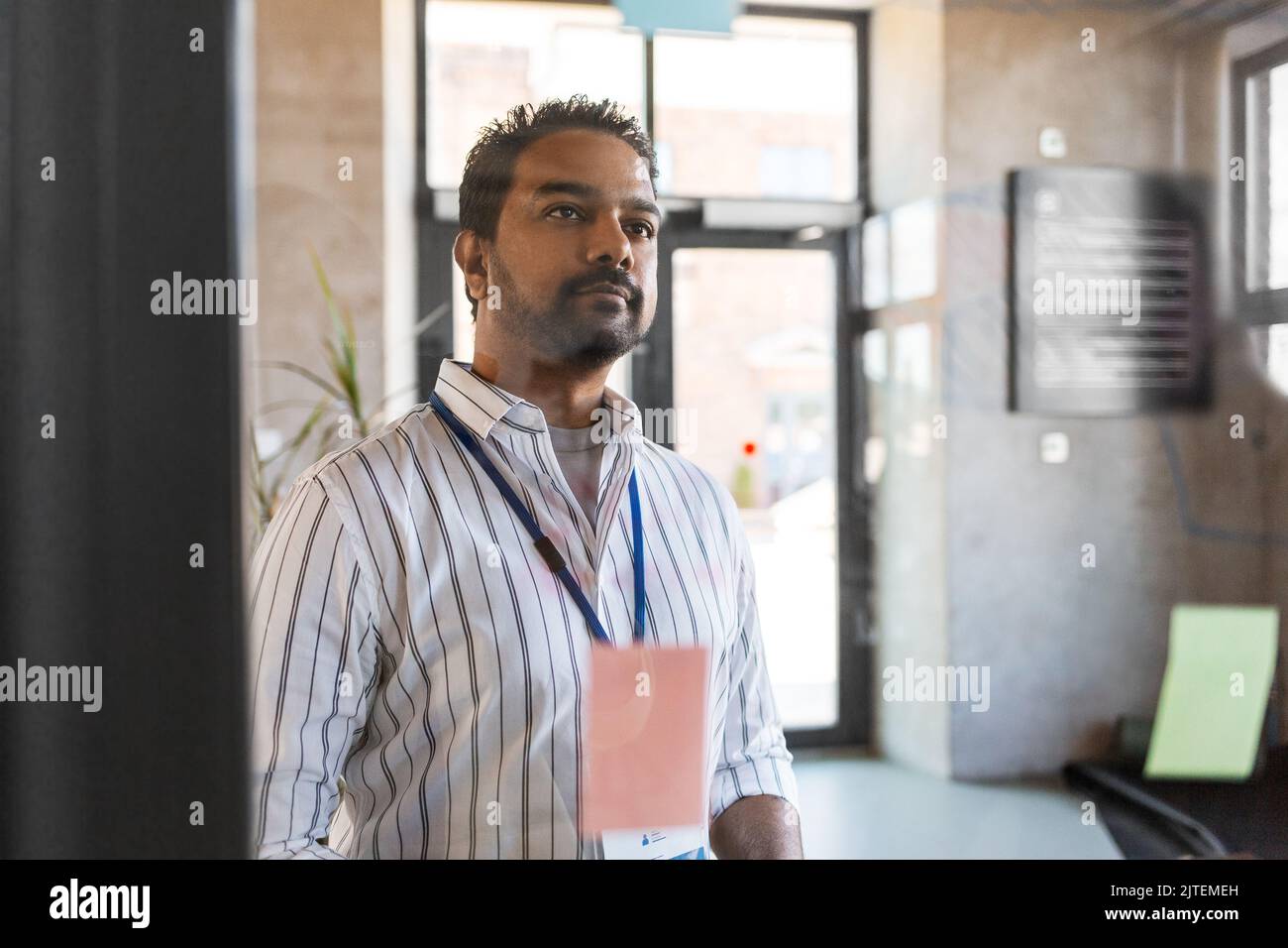 man working at office with charts on glass board Stock Photo