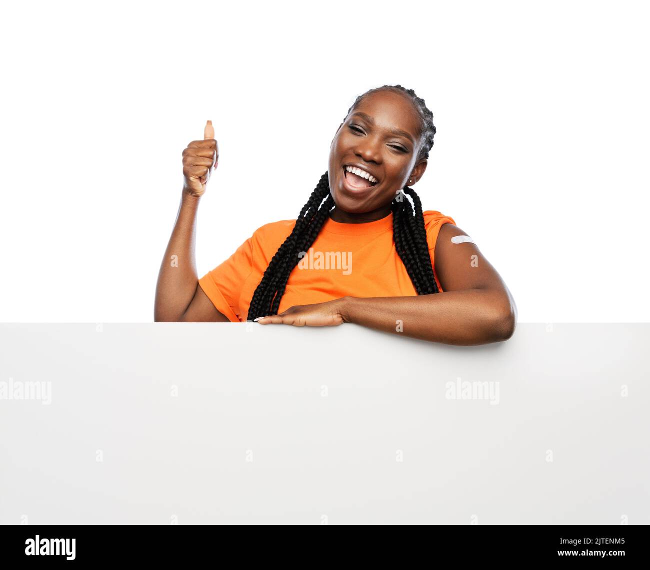 Vaccinated black woman showing hires stock