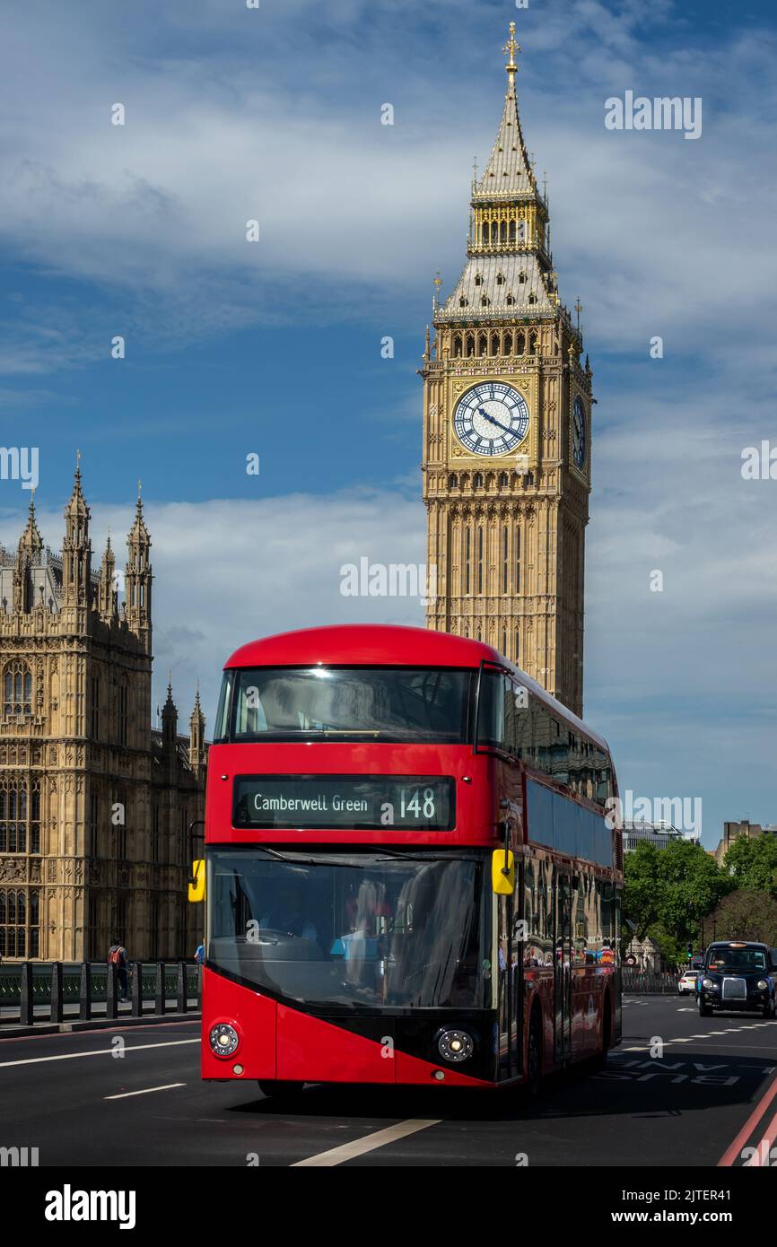 Red double decker bus on Westminster bridge, Big Ben in the background, in London, UK Stock Photo