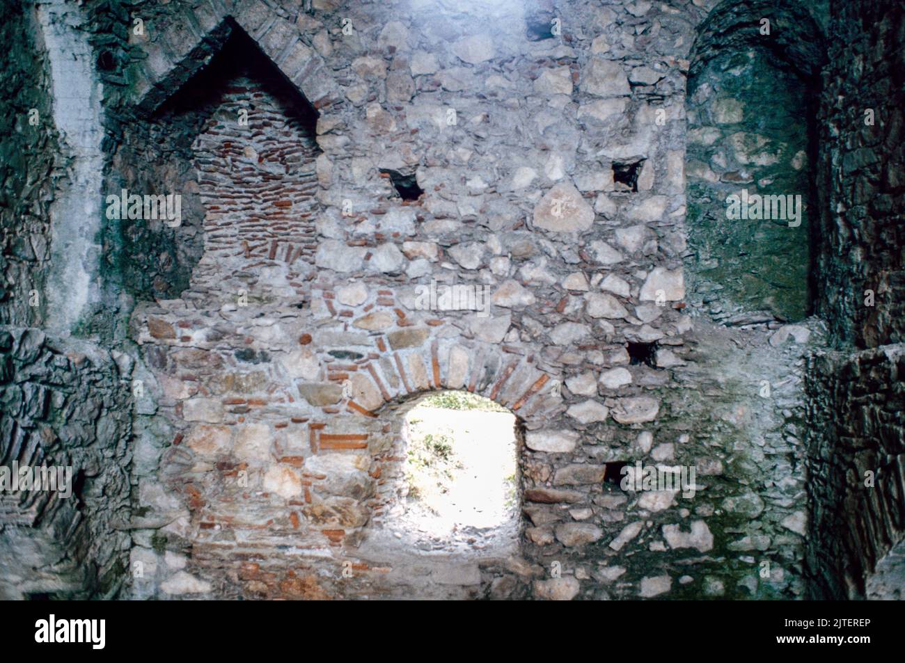 Fireplace in Despot’s Palace atMystras (Mistras or Myzithras), a fortified town and a former municipality in Laconia, Peloponnese, Greece near ancient Sparta, it served as the capital of the Byzantine Despotate of the Morea. March 1980. Archival scan from a slide. Stock Photo