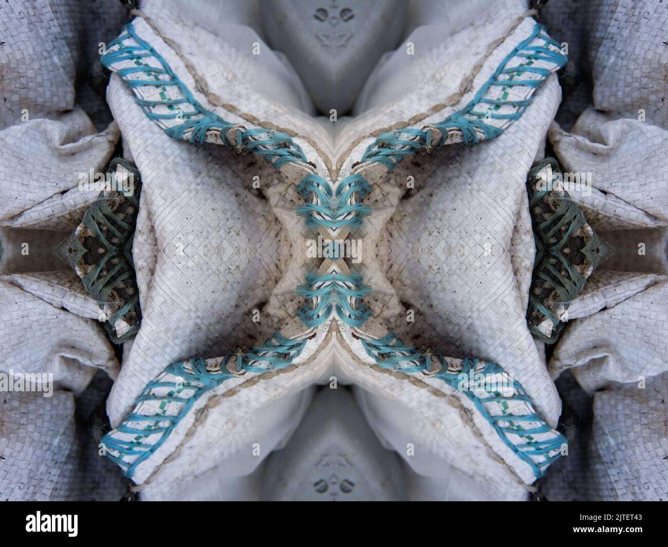 A beautiful repeat pattern formed out of folded tarpaulin with blue