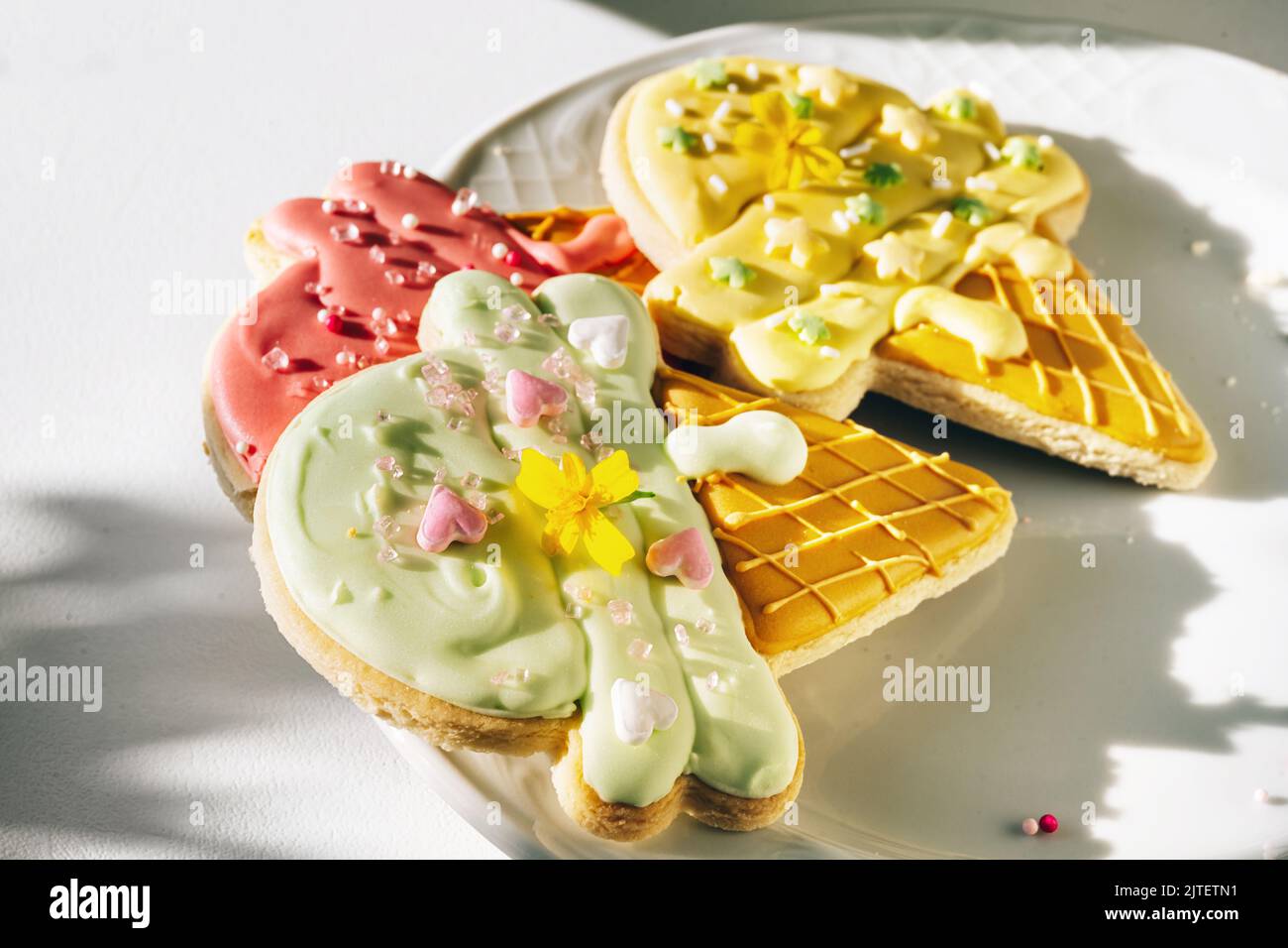 Pile of decorated sugar cookies with glase in a shape of ice cream