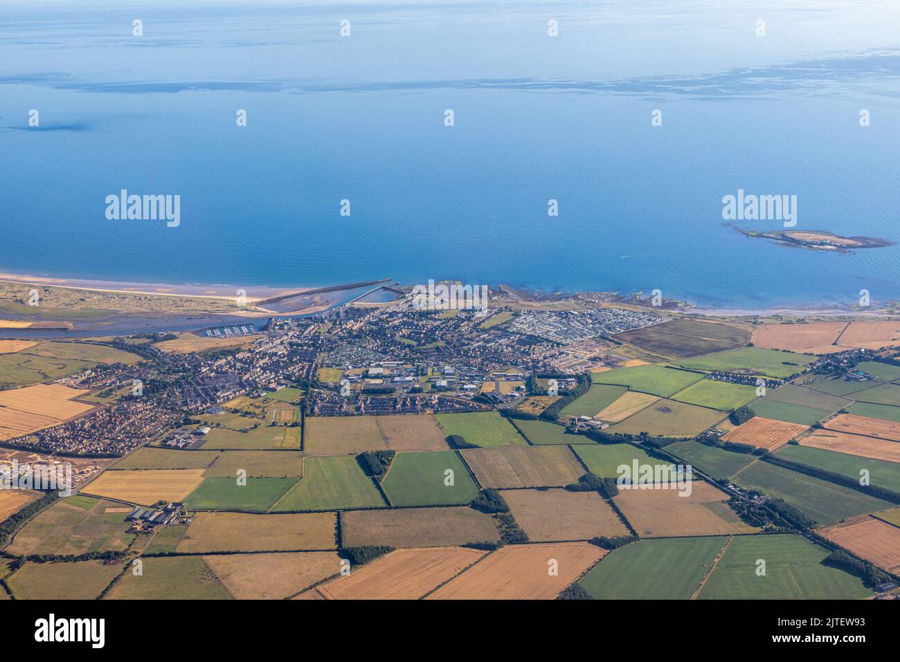 Aerial photograph of the coastal town of Amble and the Coquet Island, located on the Northumberland coast line, 25 miles north of Newcastle upon Tyne. Stock Photo