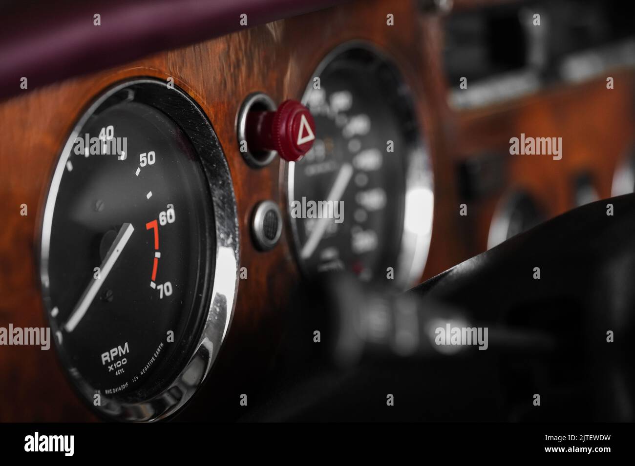 A closeup of fuel gauge and speedometer in a retro car Stock Photo Alamy