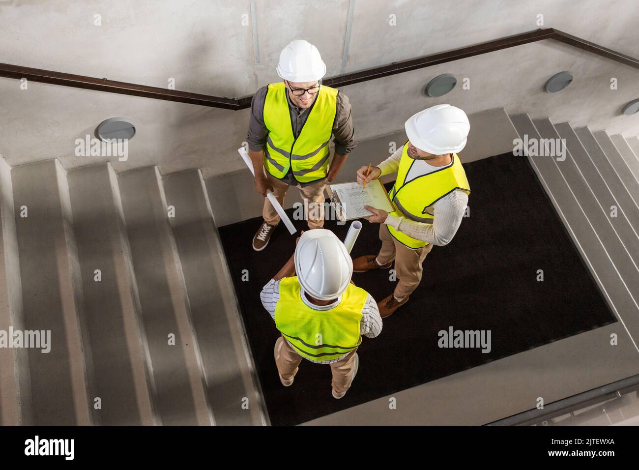 architects in helmets working at office Stock Photo