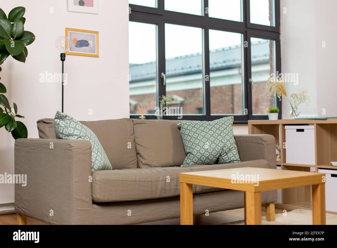 sofa with cushions at cozy home living room Stock Photo - Alamy