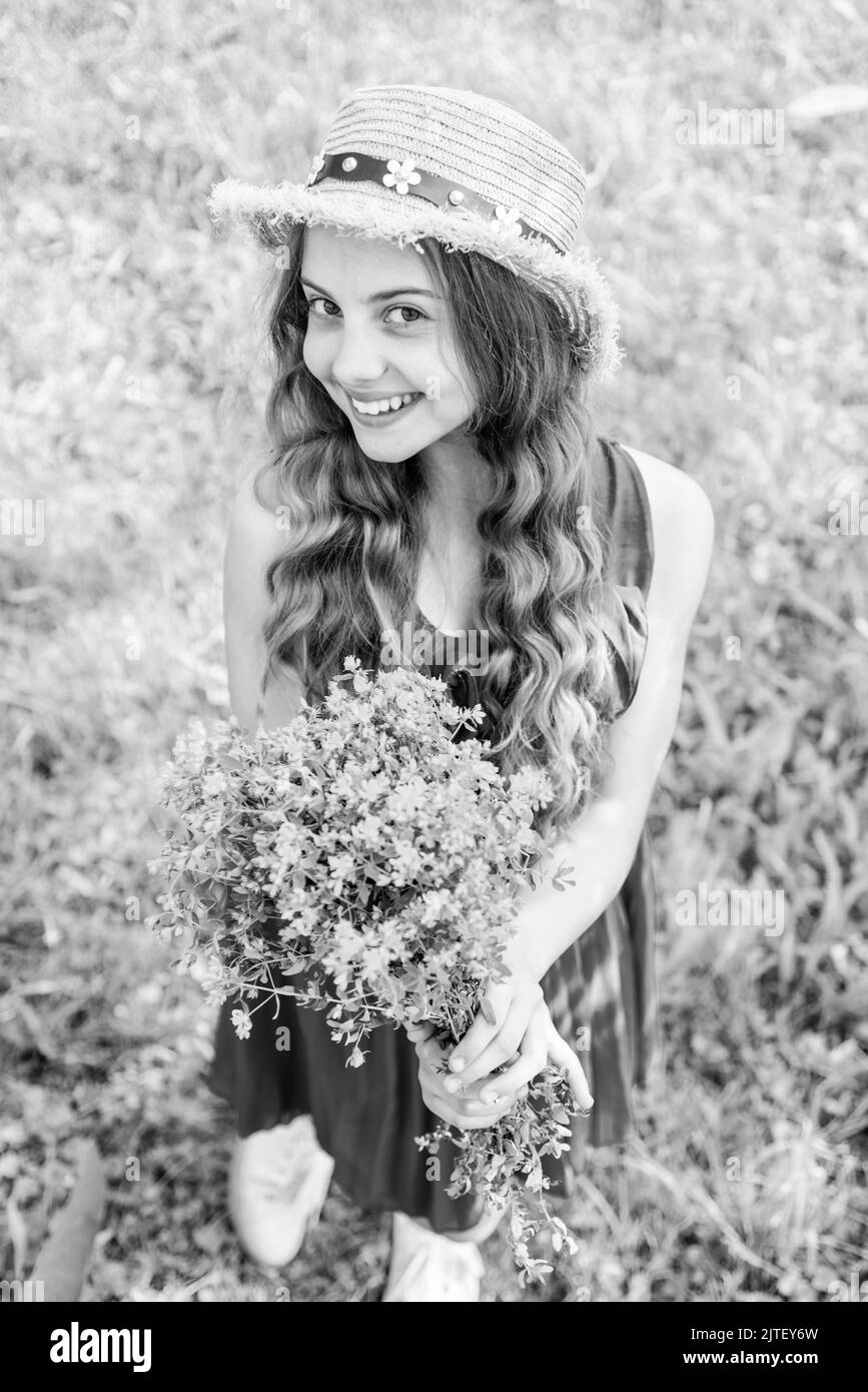 Curly hair girl flower Black and White Stock Photos & Images - Alamy