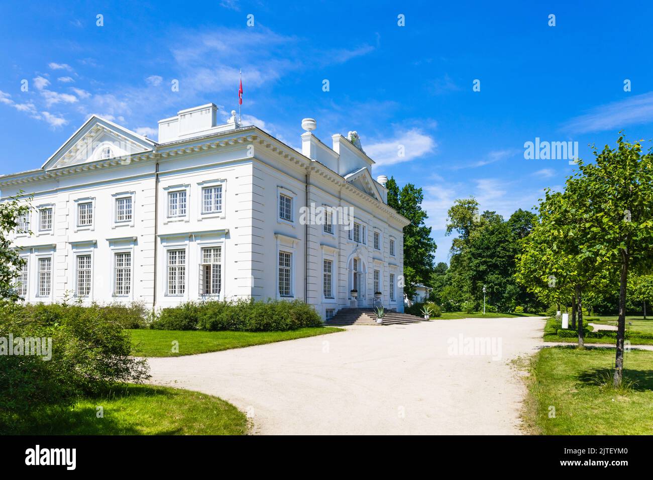 Uzutrakis manor. Colonnaded mansion set in landscaped gardens. Trakai, Lithuania, 2 July 2022 Stock Photo