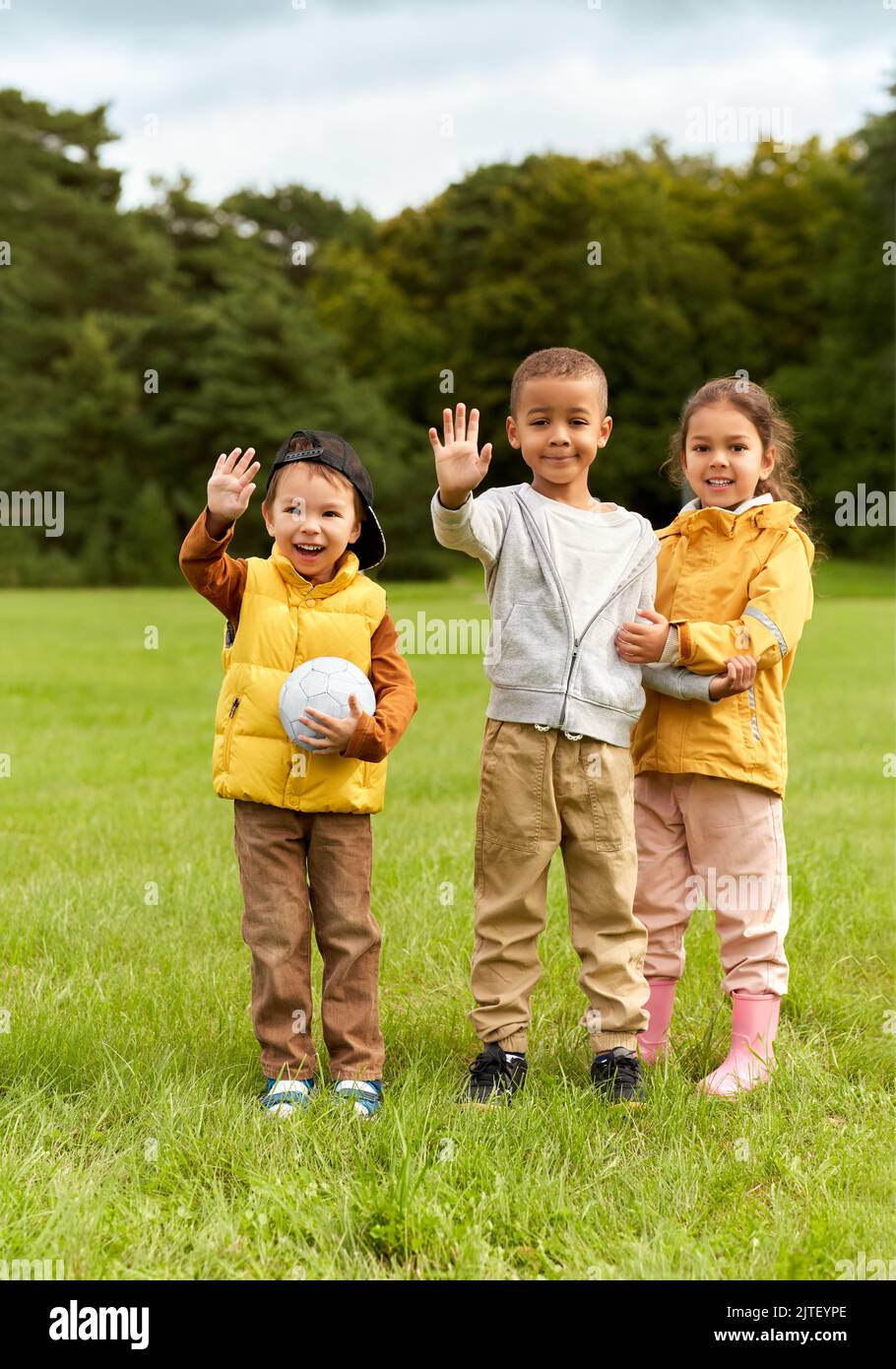 happy children with soccer ball at park Stock Photo - Alamy