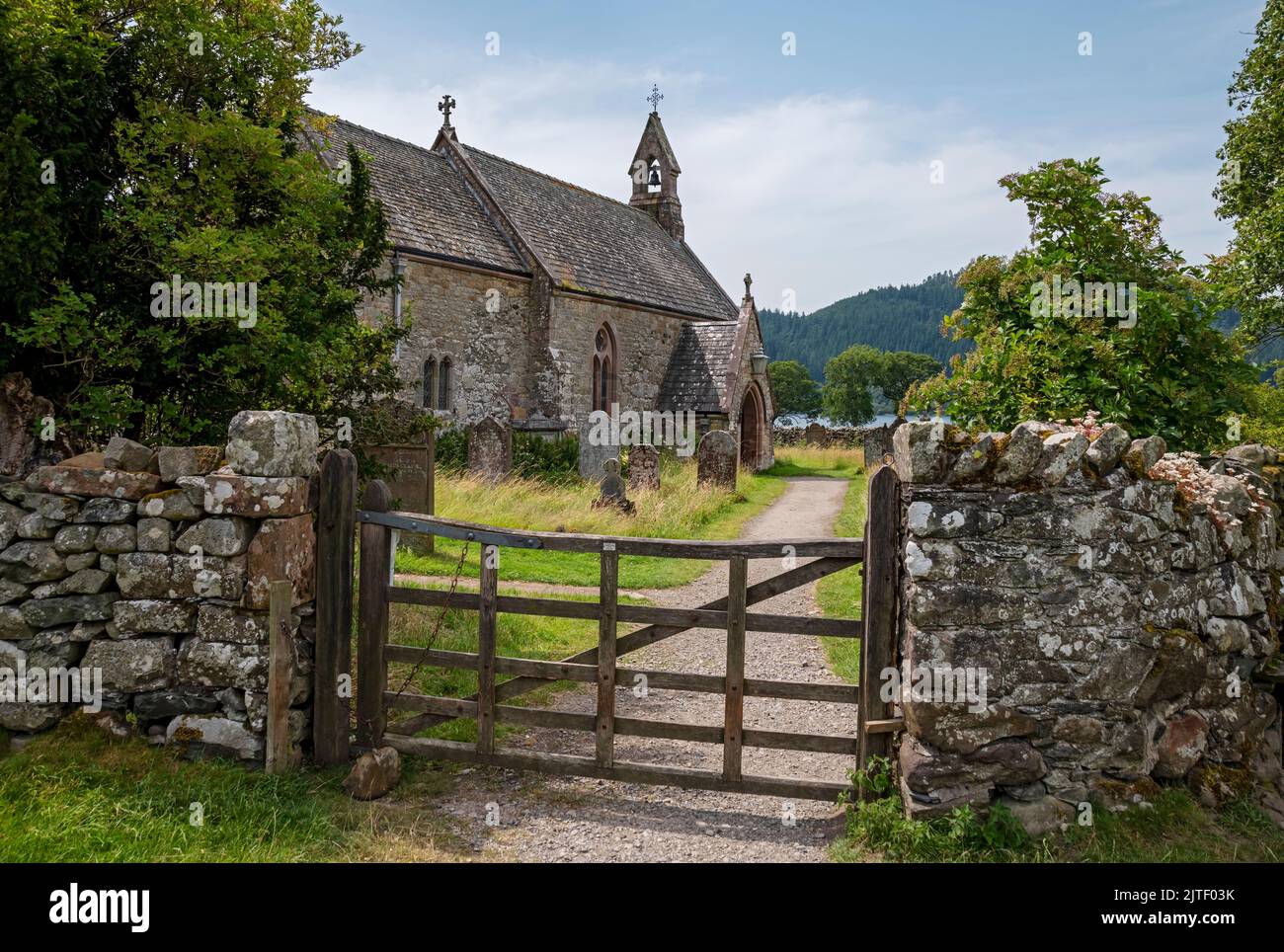 St Begas Parish Church and gravestone graves graveyard near Bassenthwaite Lake in summer Lake District National Park Cumbria England UK Britain Stock Photo