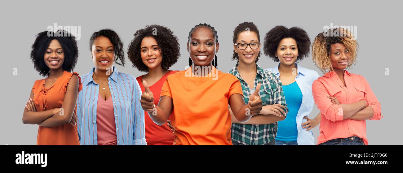 happy african american women showing thumbs up Stock Photo - Alamy