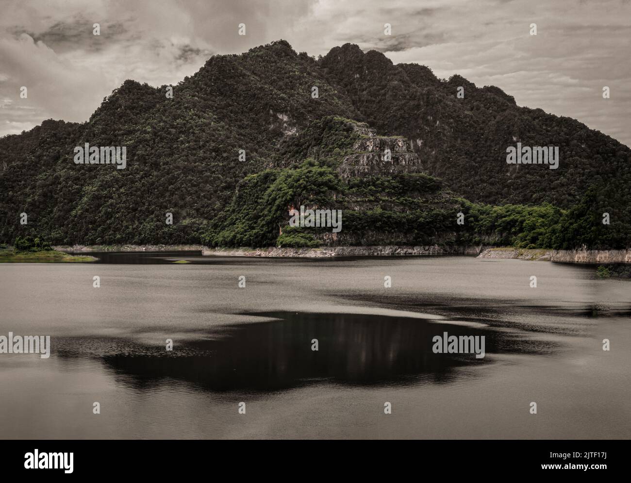 Natural scenery of water in reservoirs and dam with sky and mountains range in background. Copy space, No focus, specifically. Stock Photo