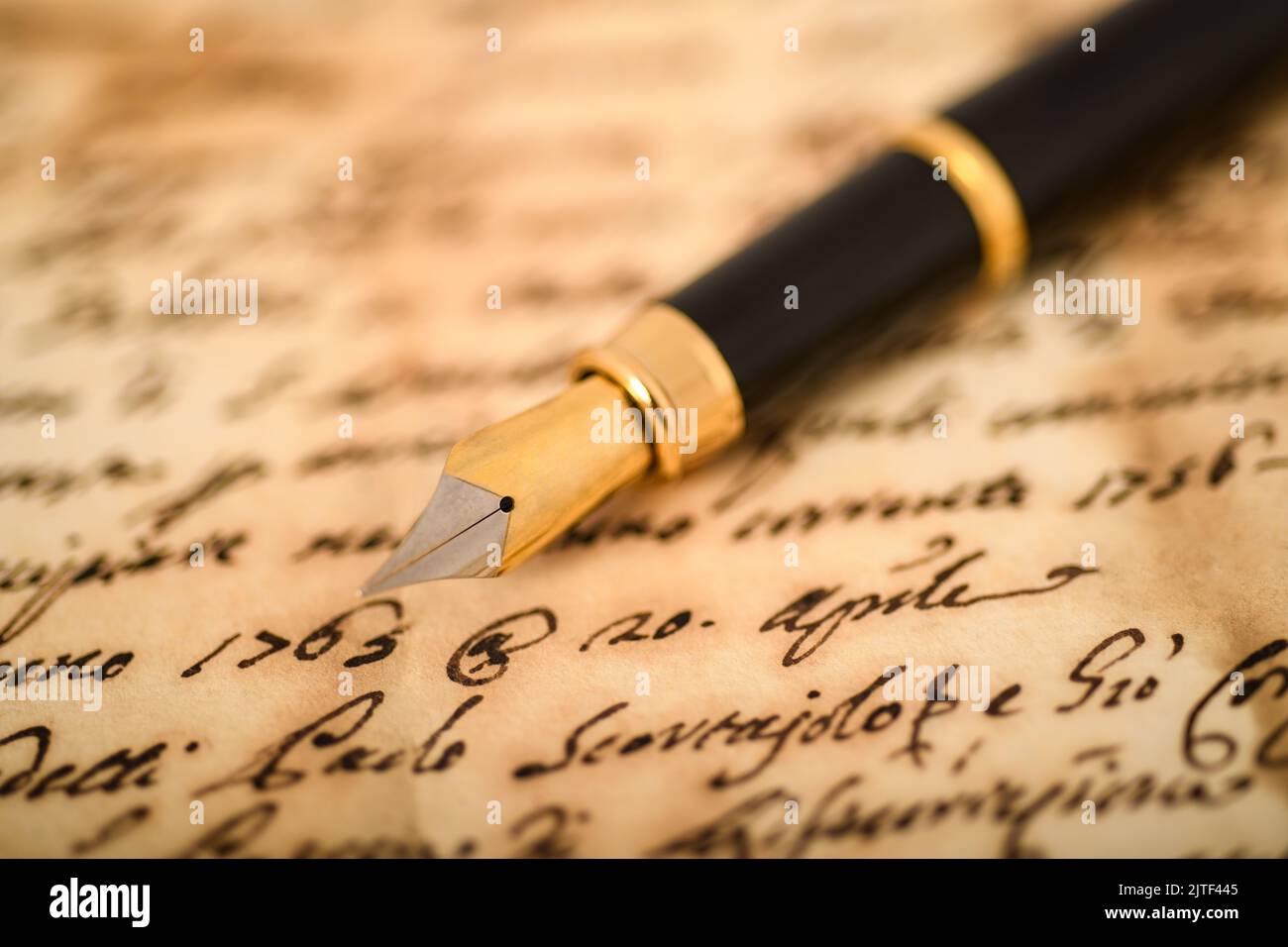 Fountain pen on a blurred  letter background Stock Photo