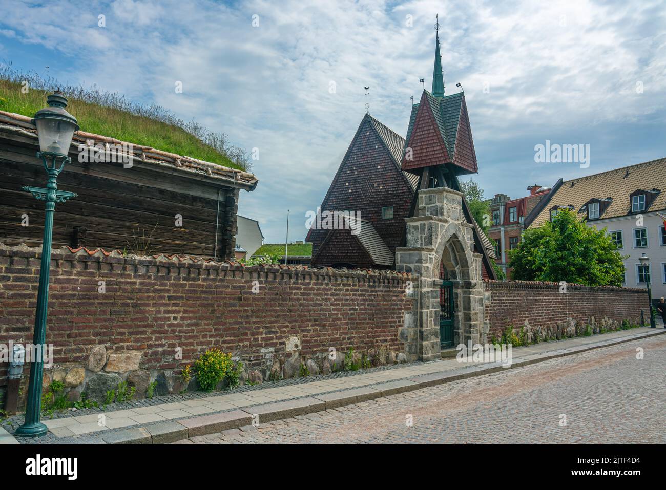 Lund, Sweden - June 9, 2022: Gate to old medieval settlings in a university city well preserved Stock Photo