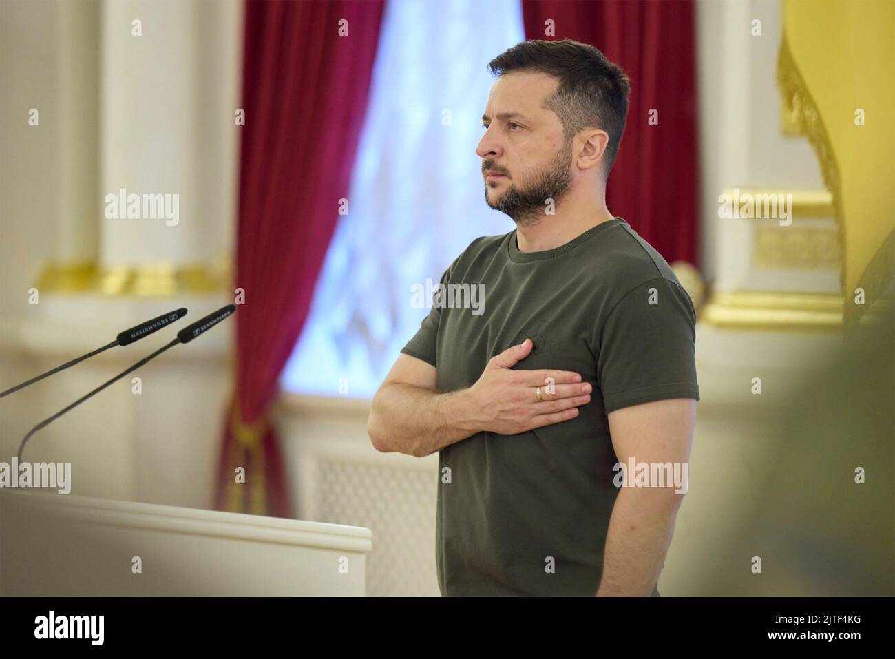 Kyiv, Ukraine. 29th Aug, 2022. Ukrainian President Volodymyr Zelenskyy, stands for the national anthem during a presentation of Gold Star Orders to the relatives of fallen Ukrainian defenders in the White Hall of Heroes at the Mariinskyi Palace, August 29, 2022 in Kyiv, Ukraine. Credit: Sarsenov Daniiar/Ukraine Presidency/Alamy Live News Stock Photo
