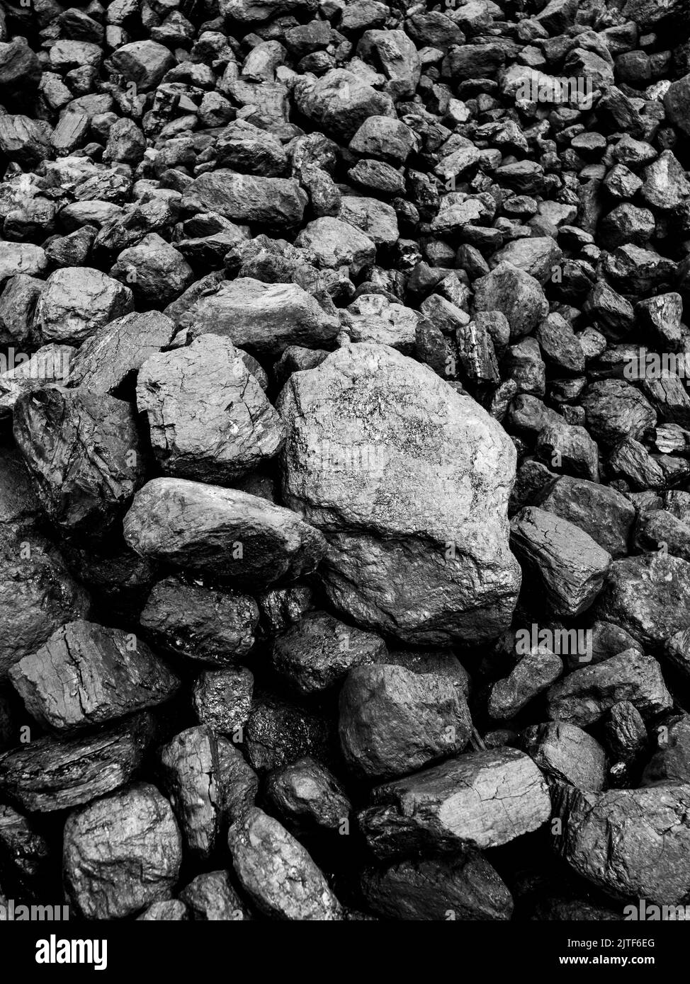A pile of coal in a railway shunting yard. Stock Photo
