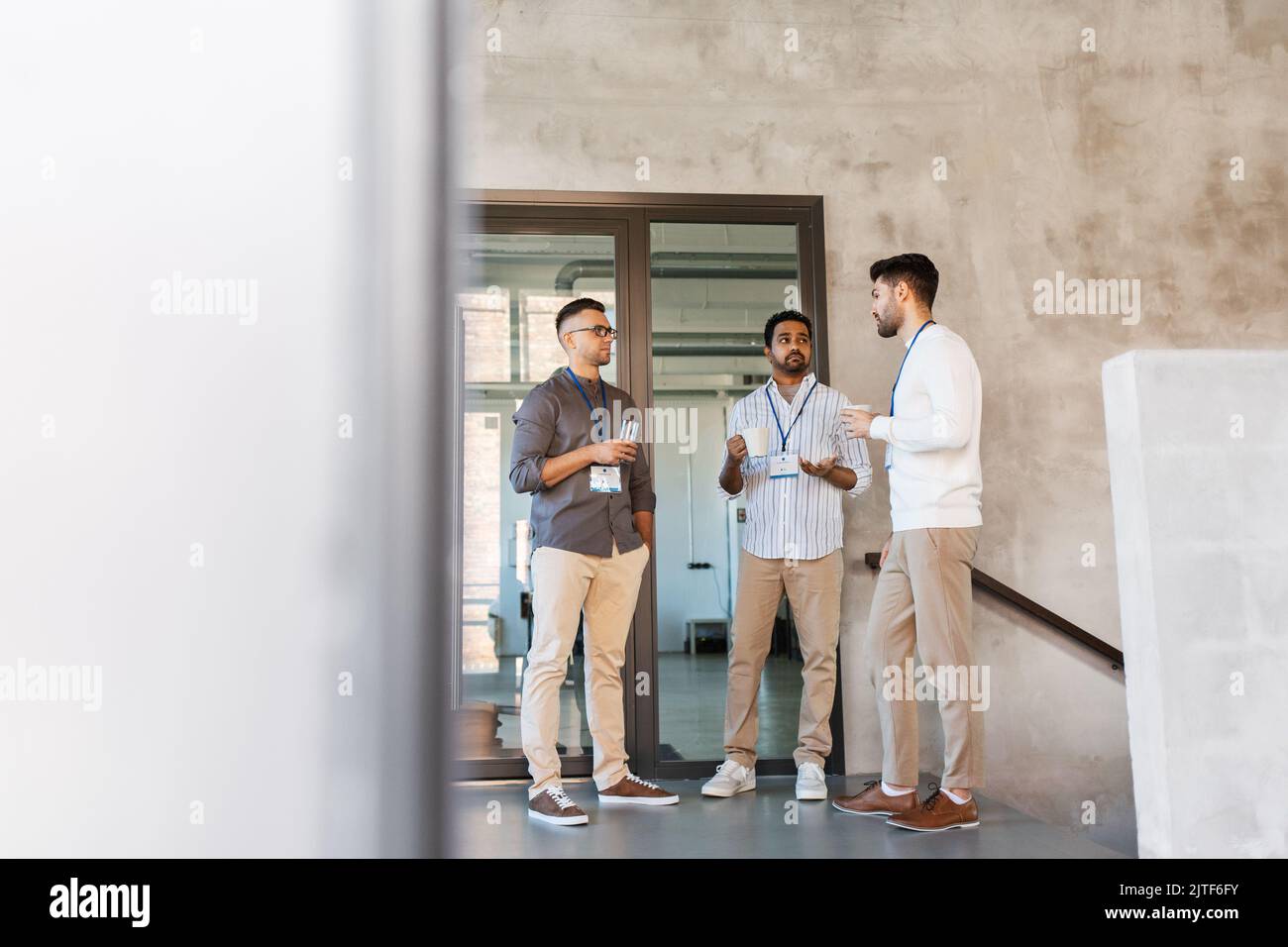 businessmen drinking coffee and water at office Stock Photo