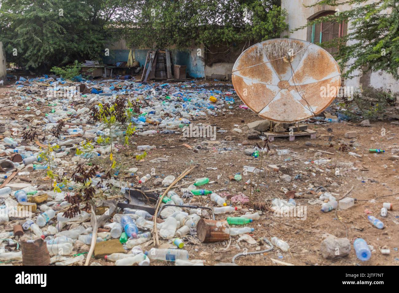 DJIBOUTI, DJIBOUTI - APRIL 17, 2019: Satellite dish in a messy yard in