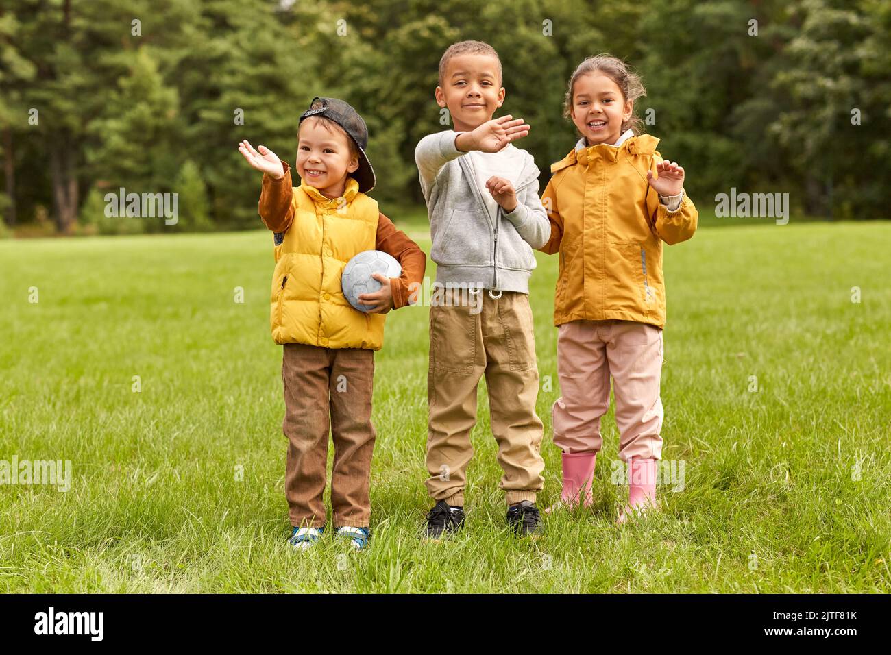 happy children with soccer ball at park Stock Photo - Alamy
