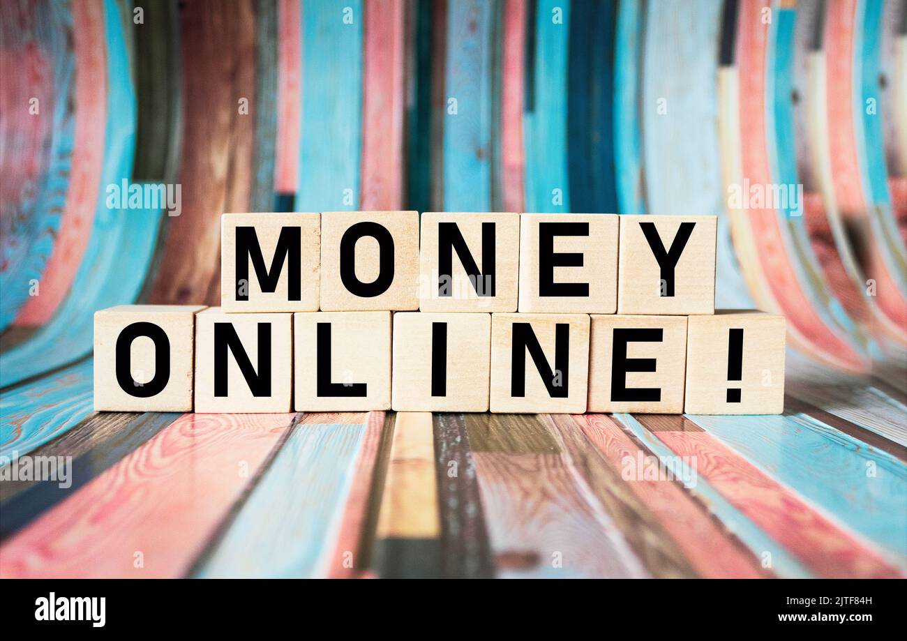 money online text on wooden blocks and beautiful vintage background. Online business concept Stock Photo