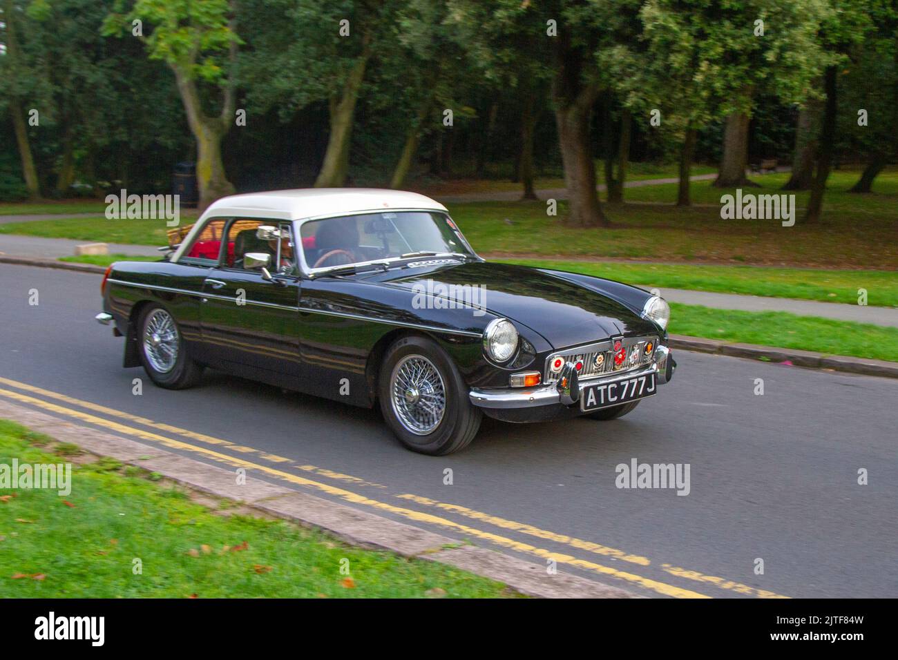 1970 70s seventies Black MG Roadster 1950cc petrol British sports car; Cars arriving at the annual Stanley Park Classic Car Show. Stanley Park classics yesteryear Motor Show is hosted by Blackpool Vintage Vehicle Preservation Group, UK. Stock Photo