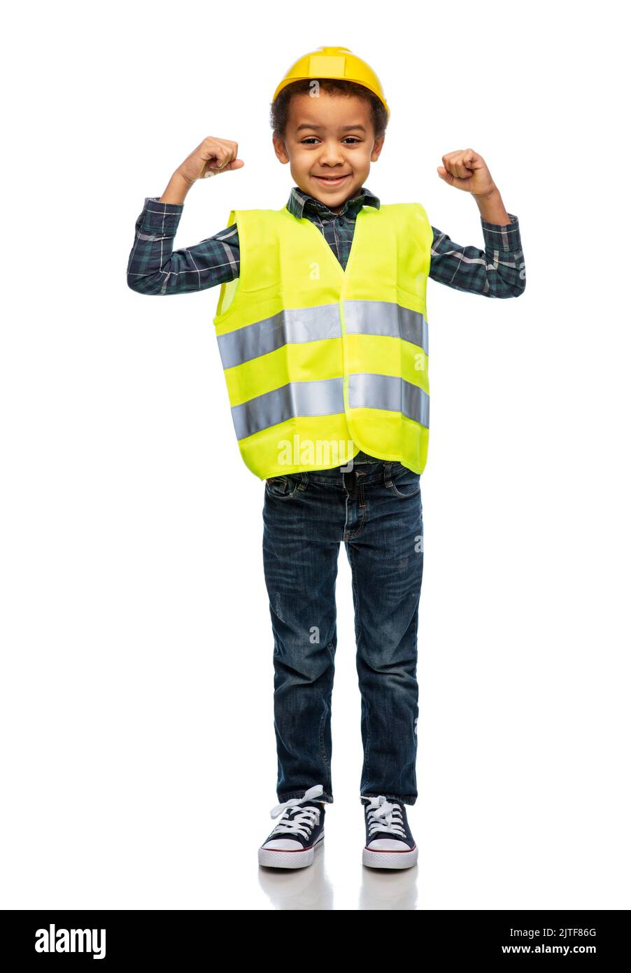 little boy in safety vest and helmet showing power Stock Photo Alamy