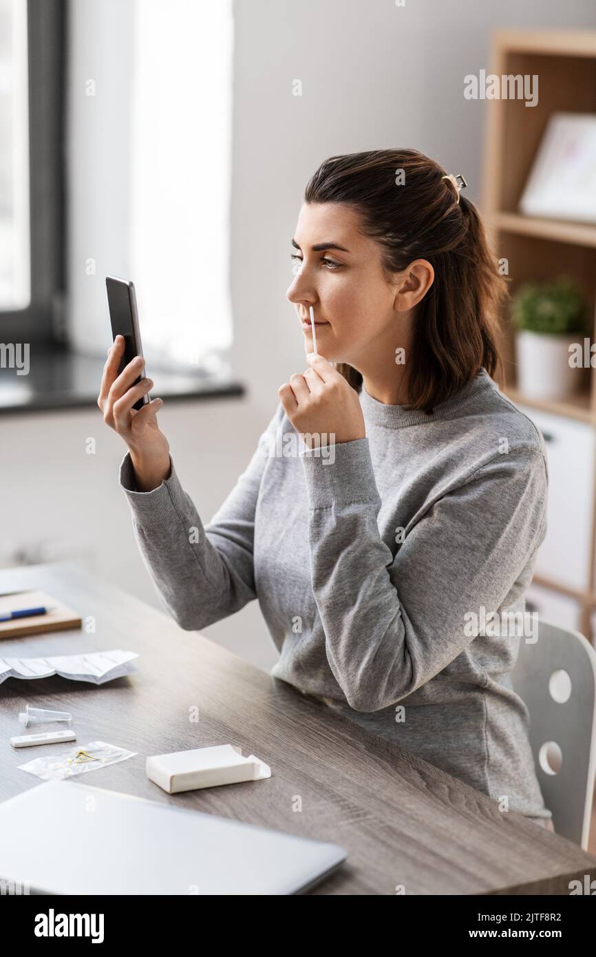 woman making coronavirus self test at home Stock Photo