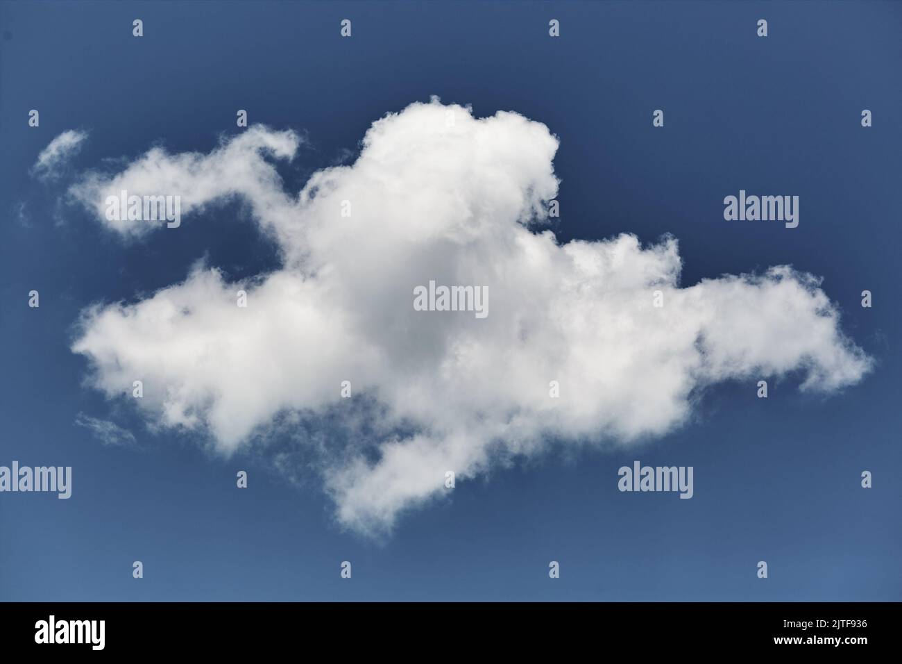 Single white cloud in blue sky Stock Photo