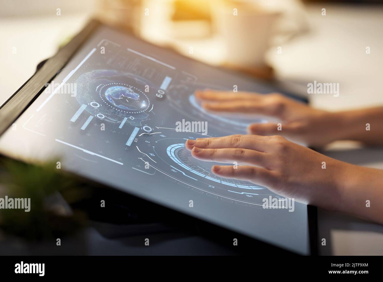 hands on led light tablet at night office Stock Photo