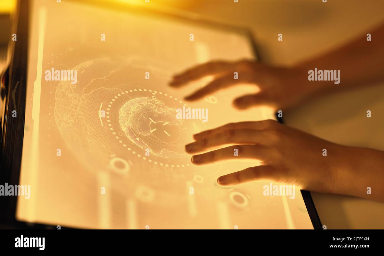 hands on led light tablet at night office Stock Photo