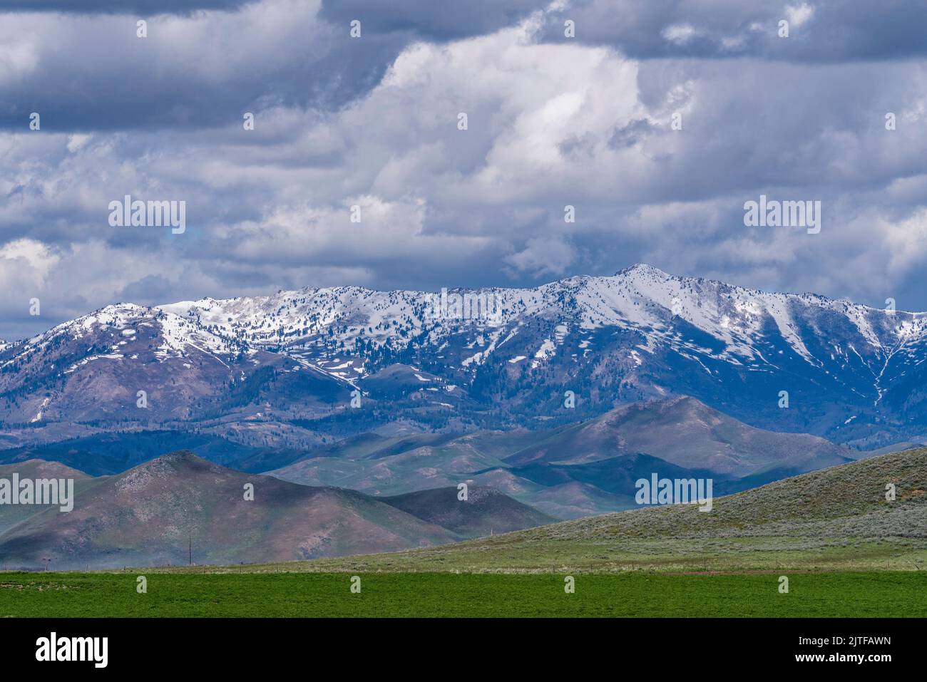 United States, Idaho, Fairfield, Clouds over snowy Soldier Mountain Stock Photo