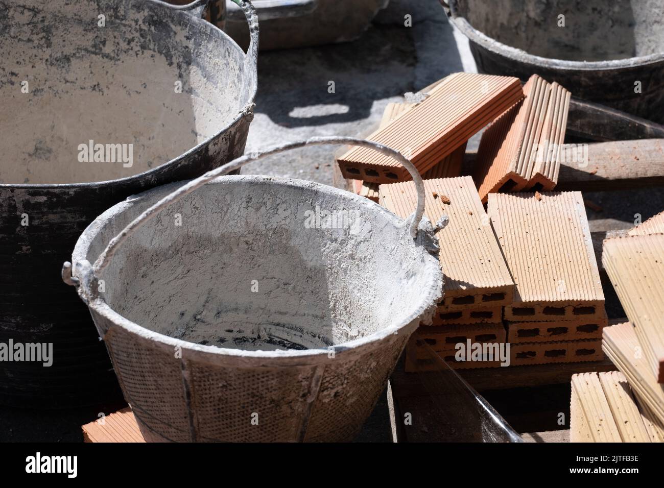 Some bags of plaster and bricks to use in the construction of a new