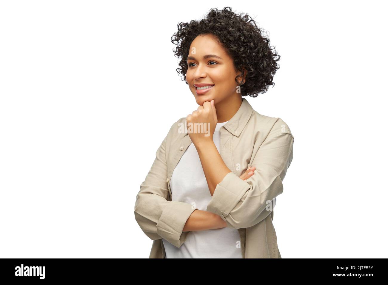 portrait of smiling thinking woman in shirt Stock Photo