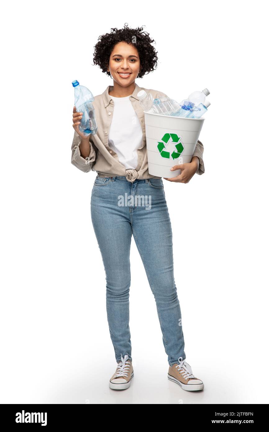 smiling young woman sorting plastic waste Stock Photo - Alamy