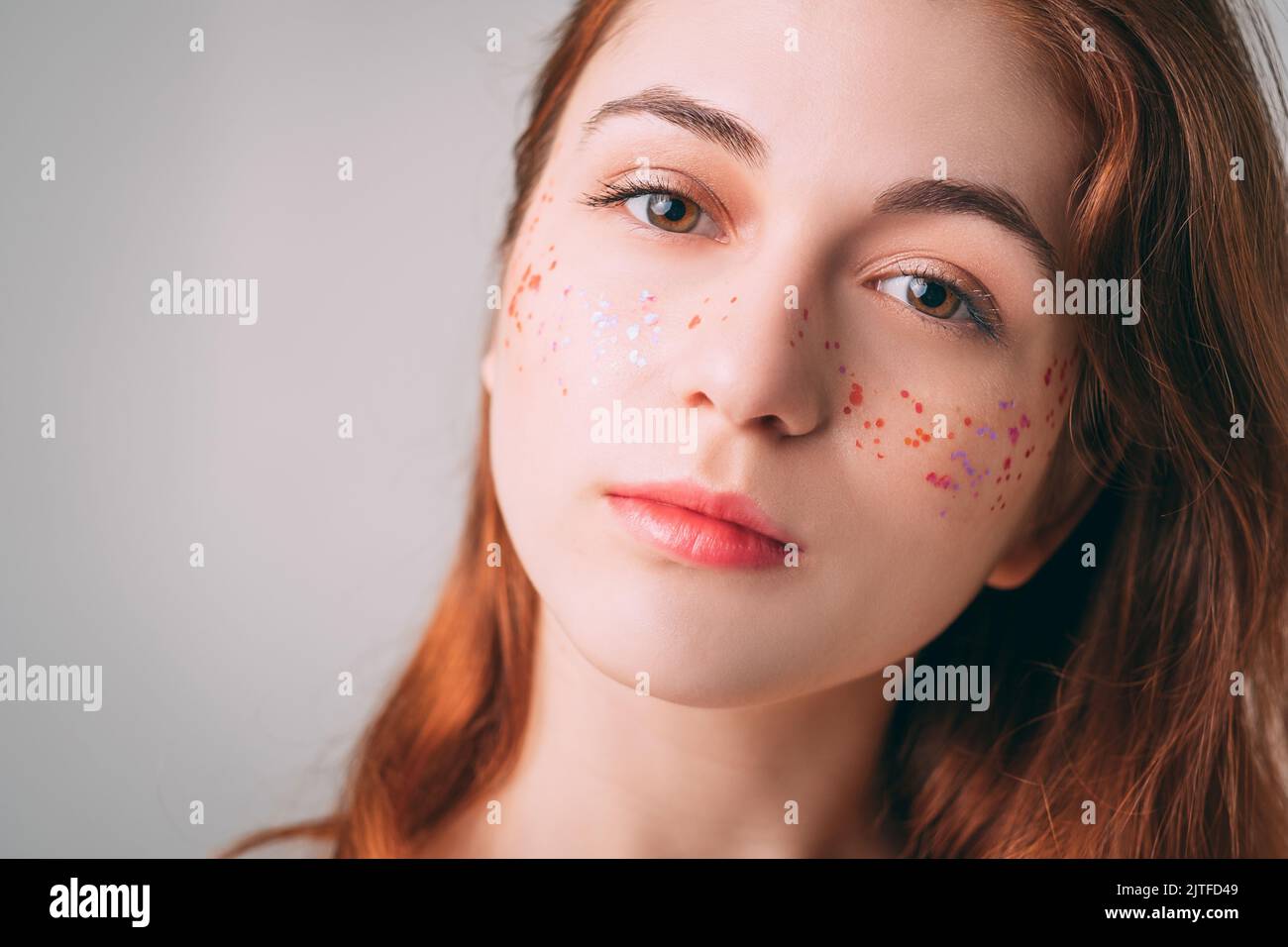 woman beauty natural makeup glitter freckles Stock Photo