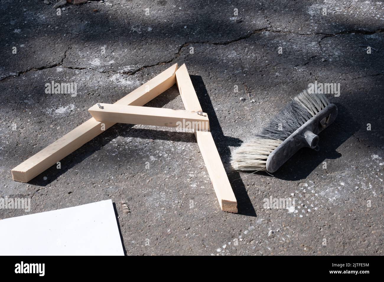 A wooden compass of angles on a construction site, building materials ...