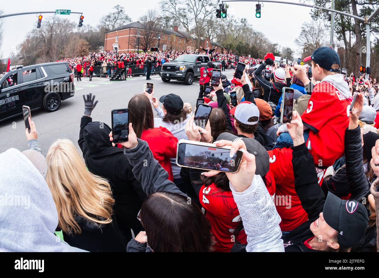 ATHENS, GA - JANUARY 15, 2022: Thousands of UGA football fans cheer on coach Kirby Smart as they celebrate at Georgia's National Championship parade. Stock Photo