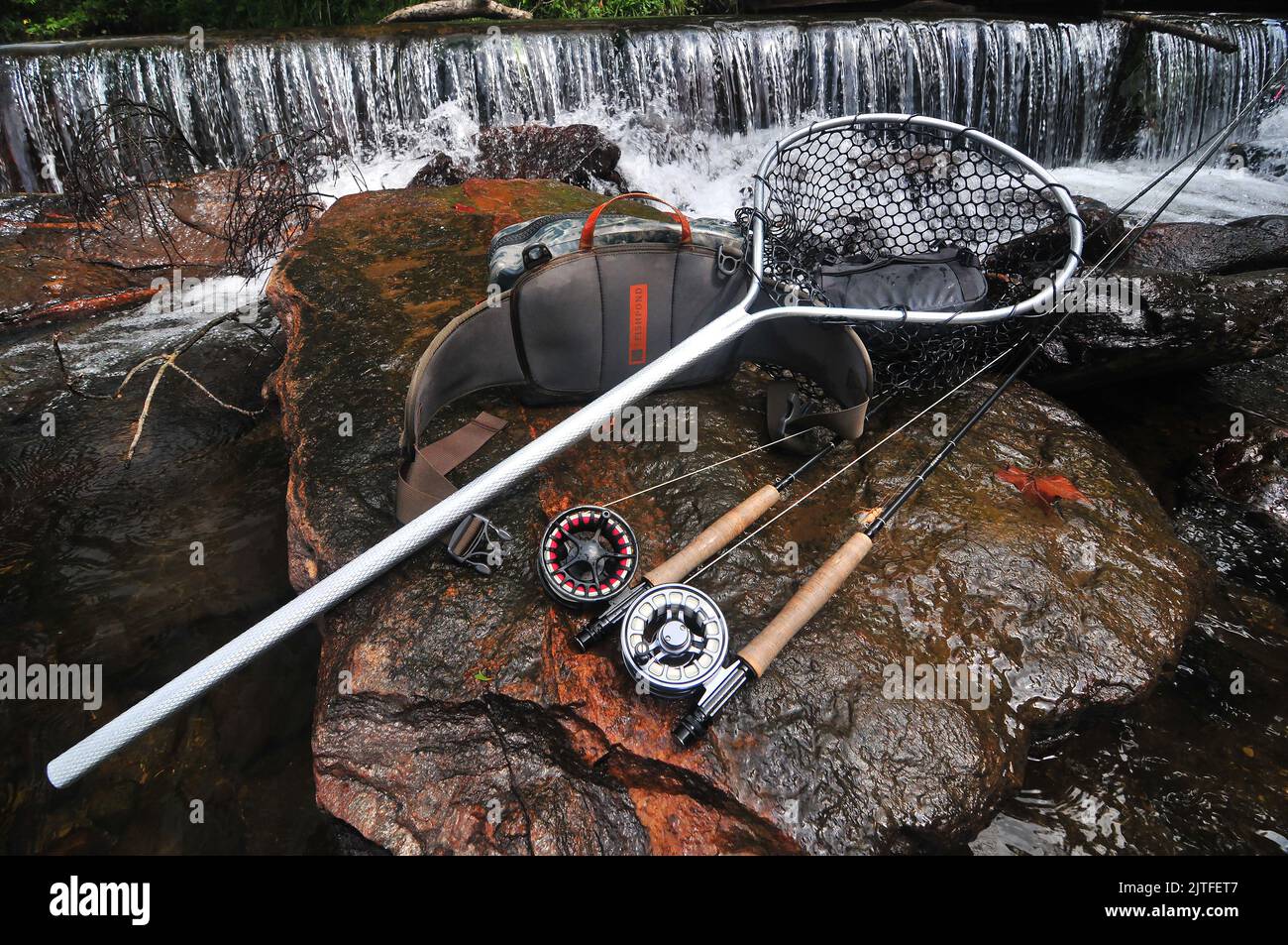 A trout fly fisherman will have a net, extra rod and leader material