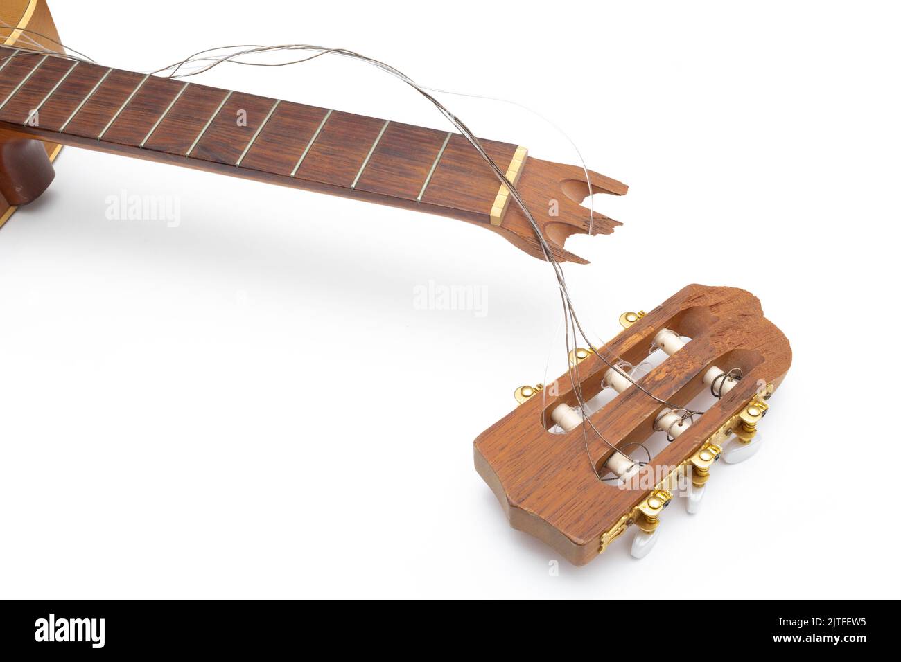 Classical acoustic guitar with broken headstock Stock Photo