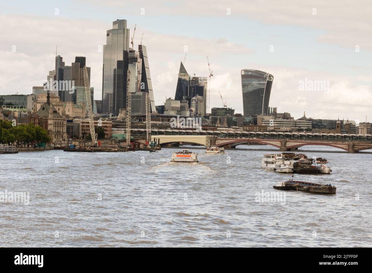 A view of the River Thames and the skyscrapers of the City of London skyline from Waterloo Bridge, London, England, UK Stock Photo