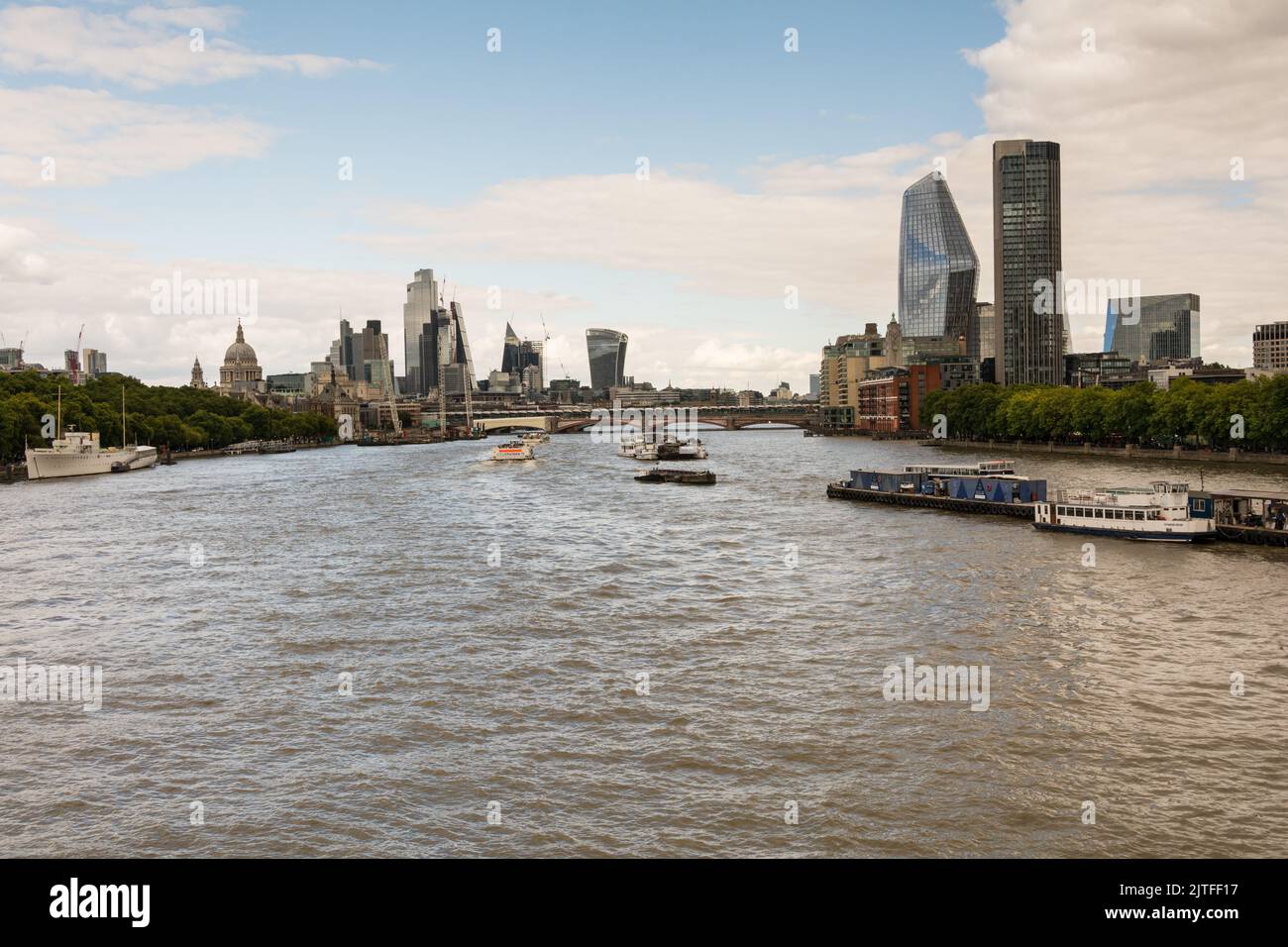 A view of the River Thames and the skyscrapers of the  City of London skyline from Waterloo Bridge, London, England, UK Stock Photo